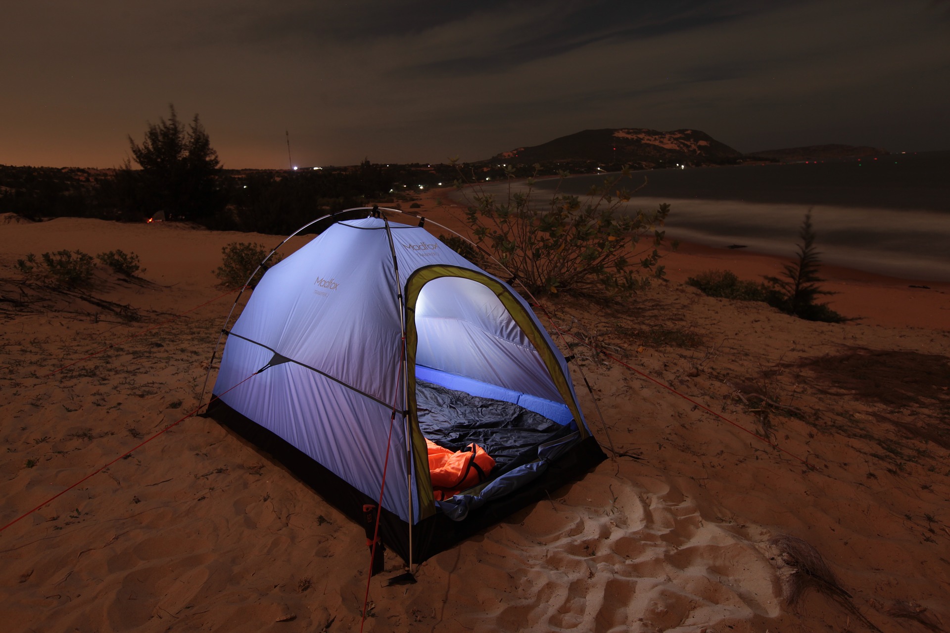Camping tent on a beach at sunset